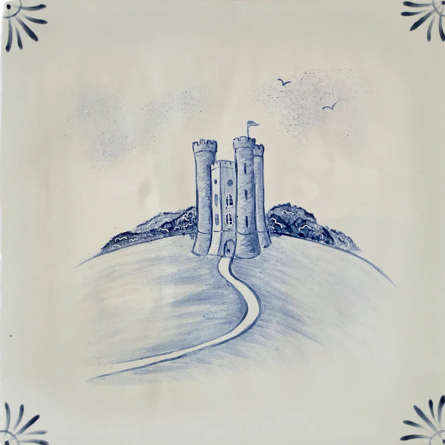 Tile with a blue castle design on a white background