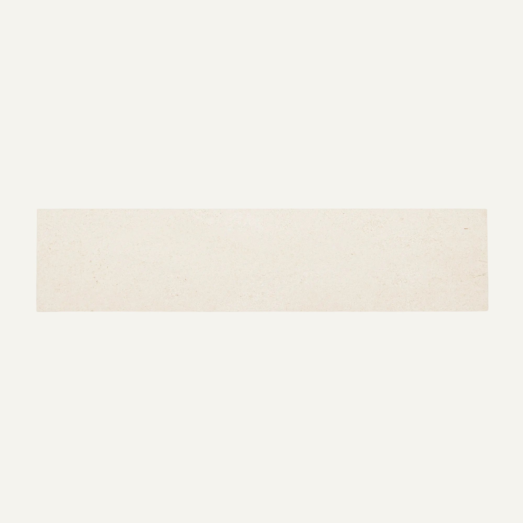 Rectangular beige tile on a white background