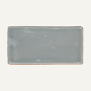 Rectangular ceramic plate with a grayish-blue finish on a white background