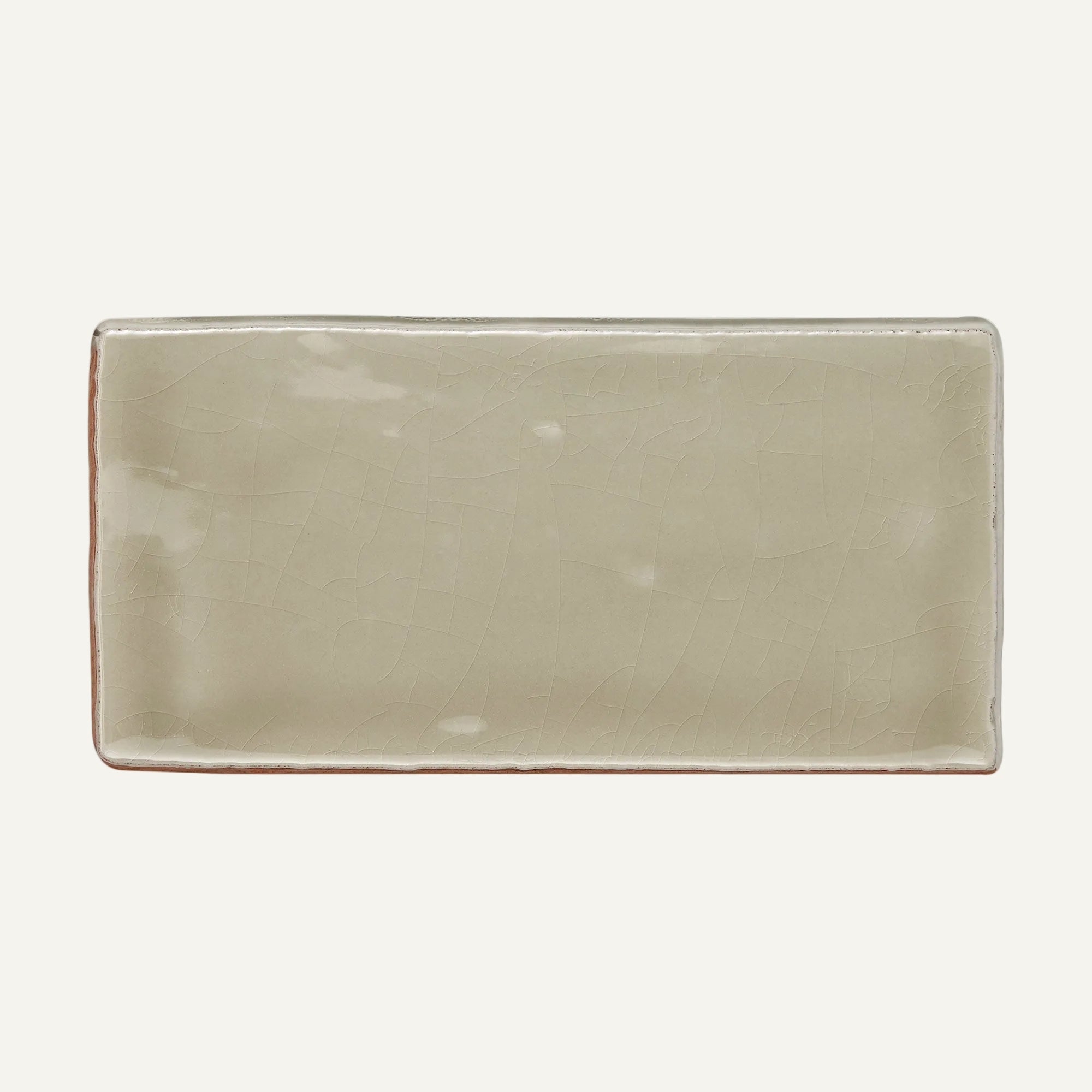 Rectangular ceramic plate with a beige finish on a white background