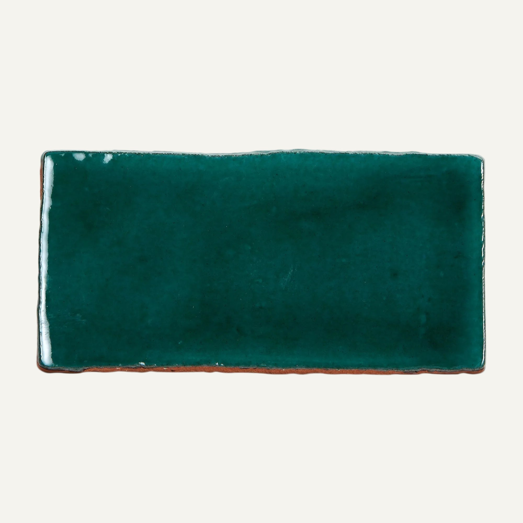 Rectangular green ceramic plate on a white background